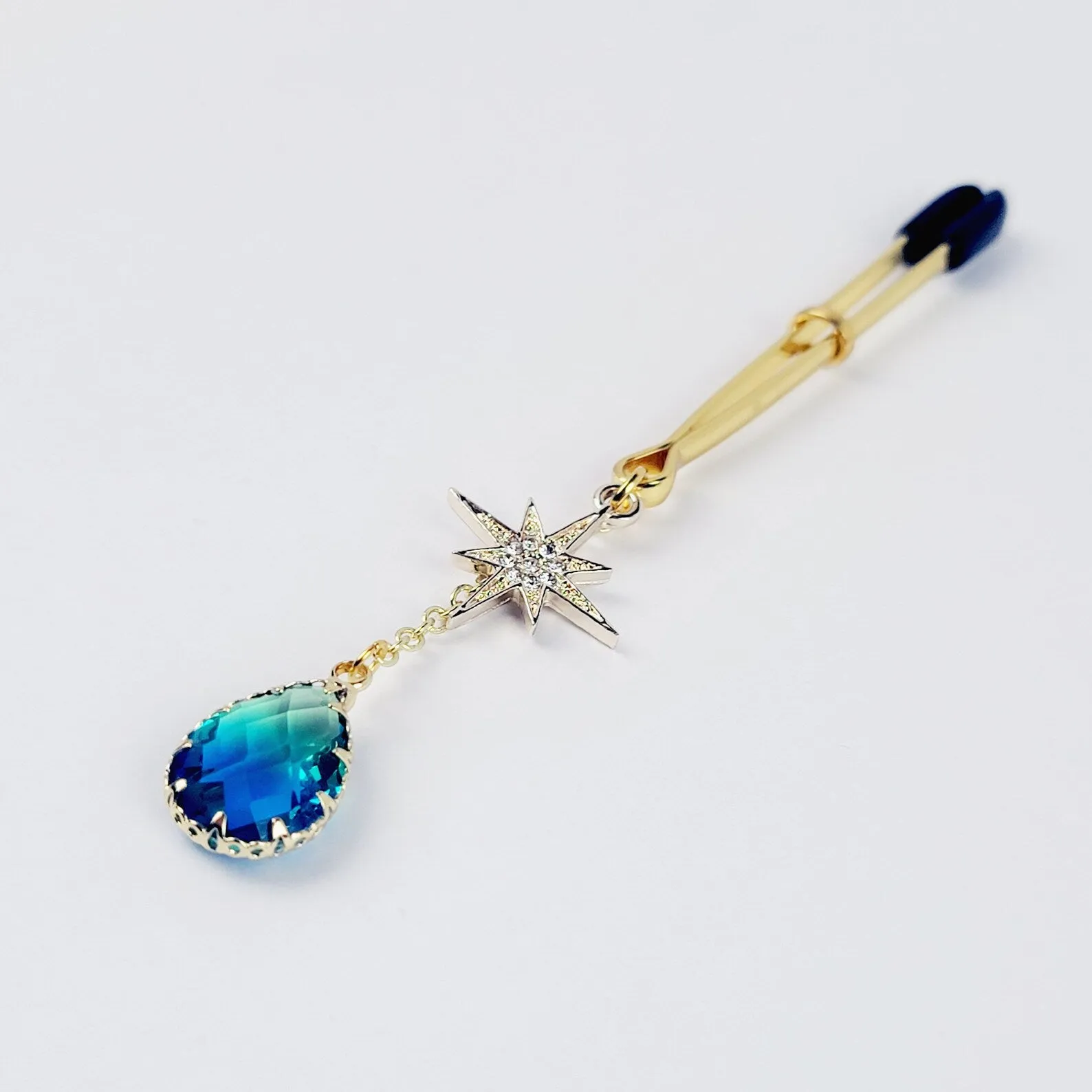 Gold Tweezer Clamp with Star and Blue Crystal