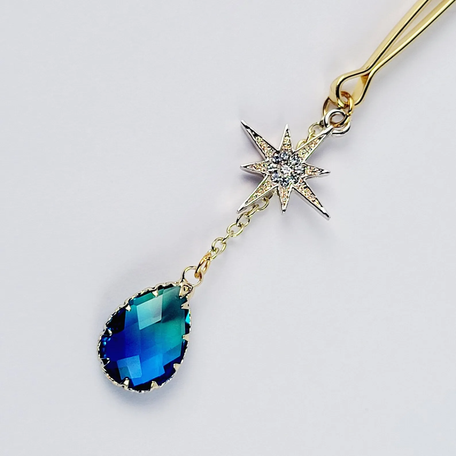 Gold Tweezer Clamp with Star and Blue Crystal