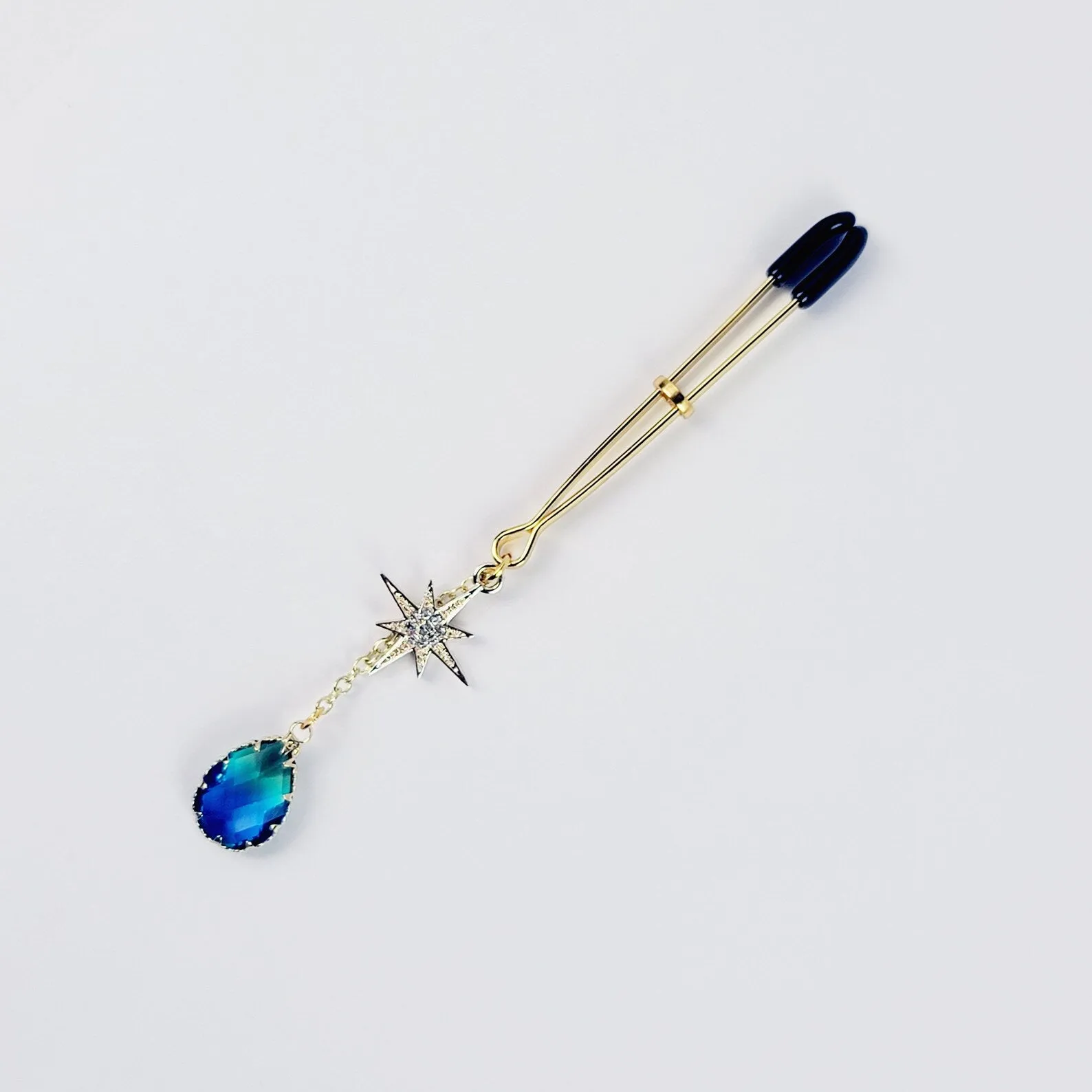 Gold Tweezer Clamp with Star and Blue Crystal