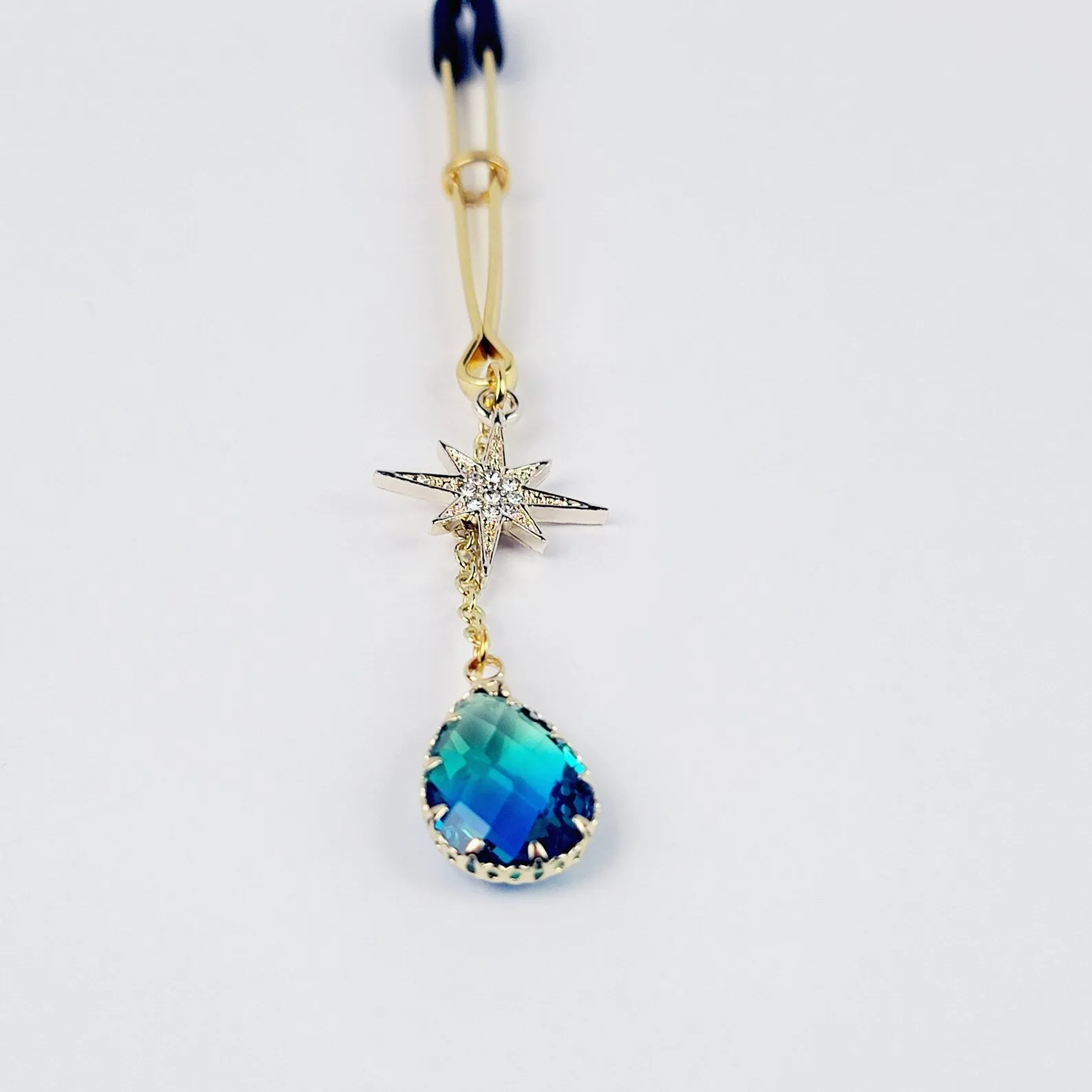 Gold Tweezer Clamp with Star and Blue Crystal